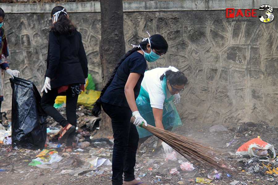 Volunteers cleaning the street