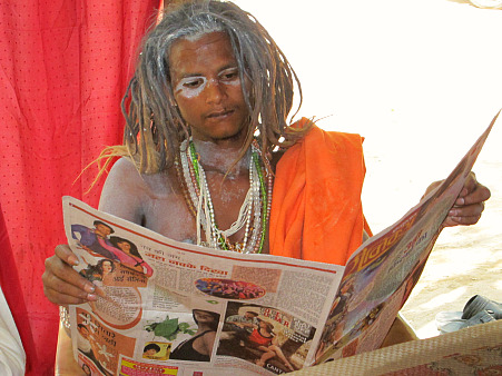 A Sadhu enjoys his morning news