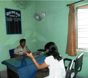 A lady officer attending the girl with a complaimt at Nashik police station